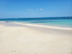 On the beach, sun-loungers, beach towels