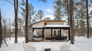 A cabin with a covered porch, stone walls, and a sign that reads "LAKE". - Luxury Honeymoon/Small Family, Hot Tub, Firewood Included (Broken Bow)