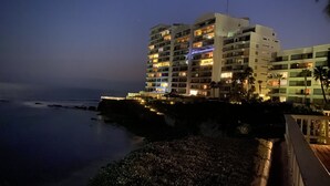 A multi-story hotel with balconies, located near a coastline. - K38 Club Marena Ground Floor With Big Patio Walkout to Fantastic Surfing (Rosarito)