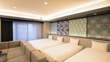 Deluxe Quadruple Room | Down comforters, in-room safe, blackout drapes, iron/ironing board