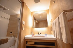 Separate tub and shower, free toiletries, hair dryer, slippers