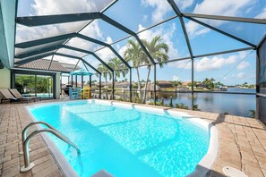 A heated pool, pool umbrellas