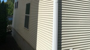 A two-story building with horizontal siding and multiple windows. - Lynnwood Airport-Retreat (Lynnwood)