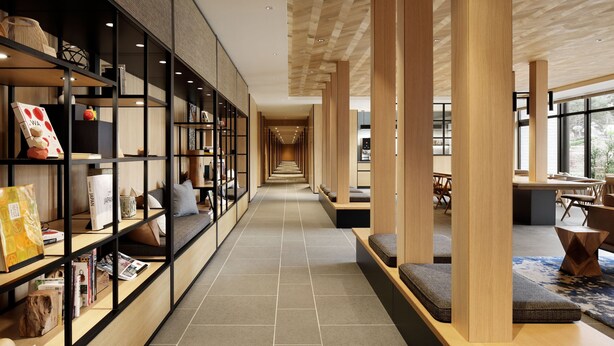A modern interior with a long hallway, wooden columns, and seating areas.