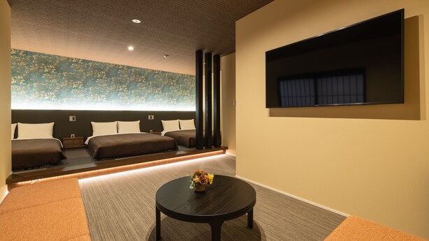 A modern hotel room with a large bed, a small table with a vase, and a large window with curtains. - HOTEL All Stay Hakata Kuko Dori (Fukuoka)