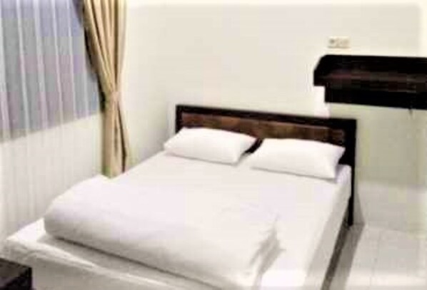 Kamar Standar | Wi-Fi gratis dan seprai linen