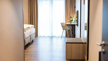 Hypo-allergenic bedding, desk, laptop workspace, blackout curtains