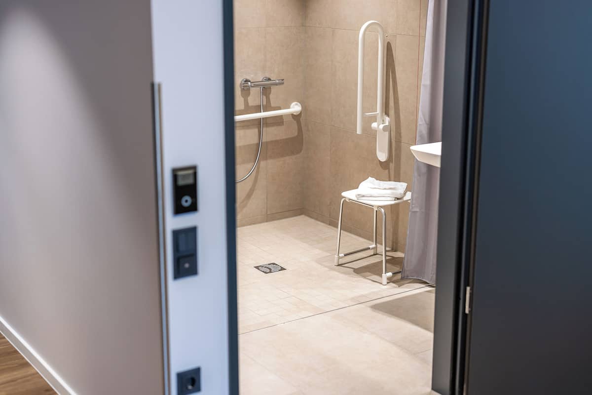 standard double room | bathroom | shower, hair dryer, towels, soap