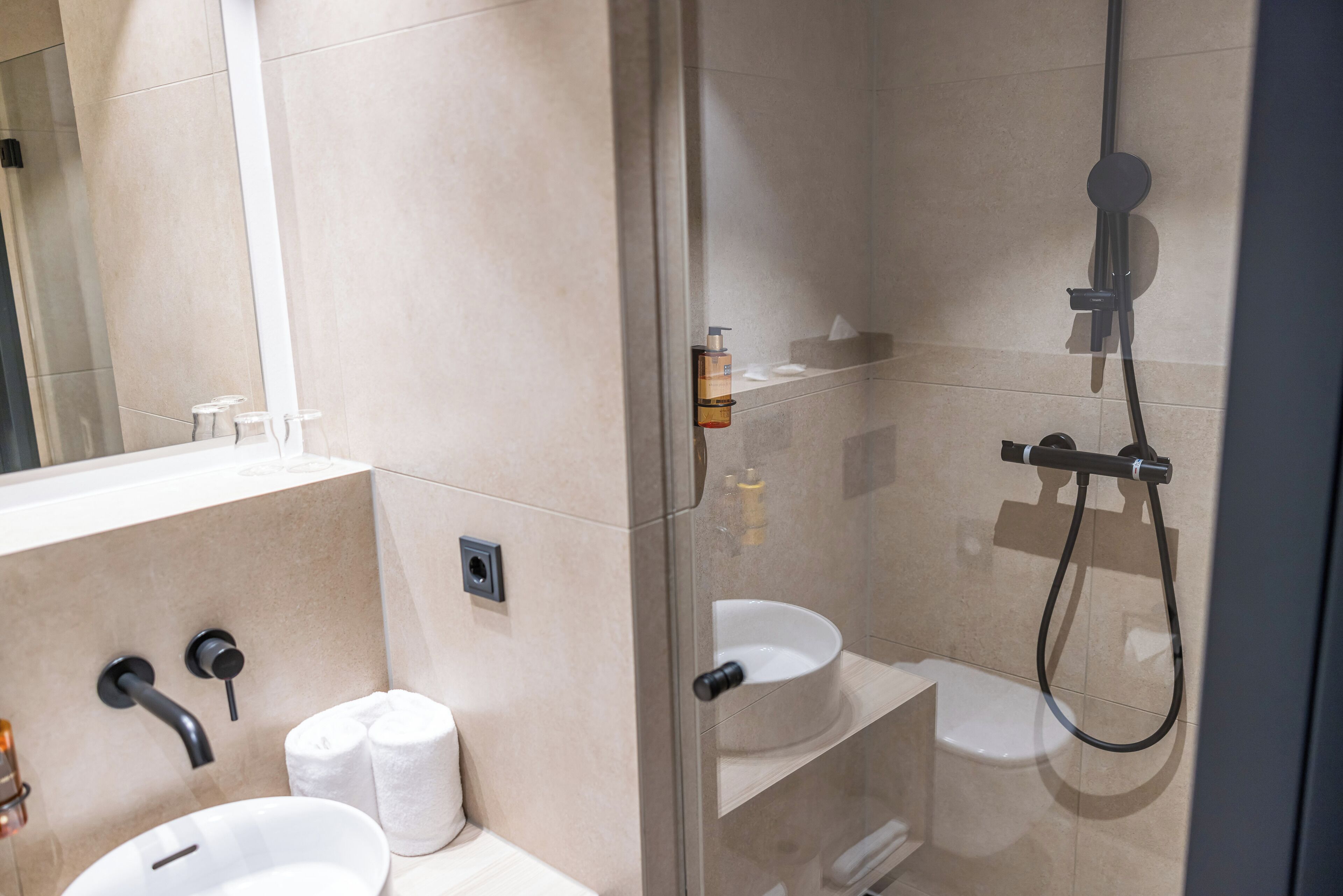 standard double room | bathroom | shower, hair dryer, towels, soap