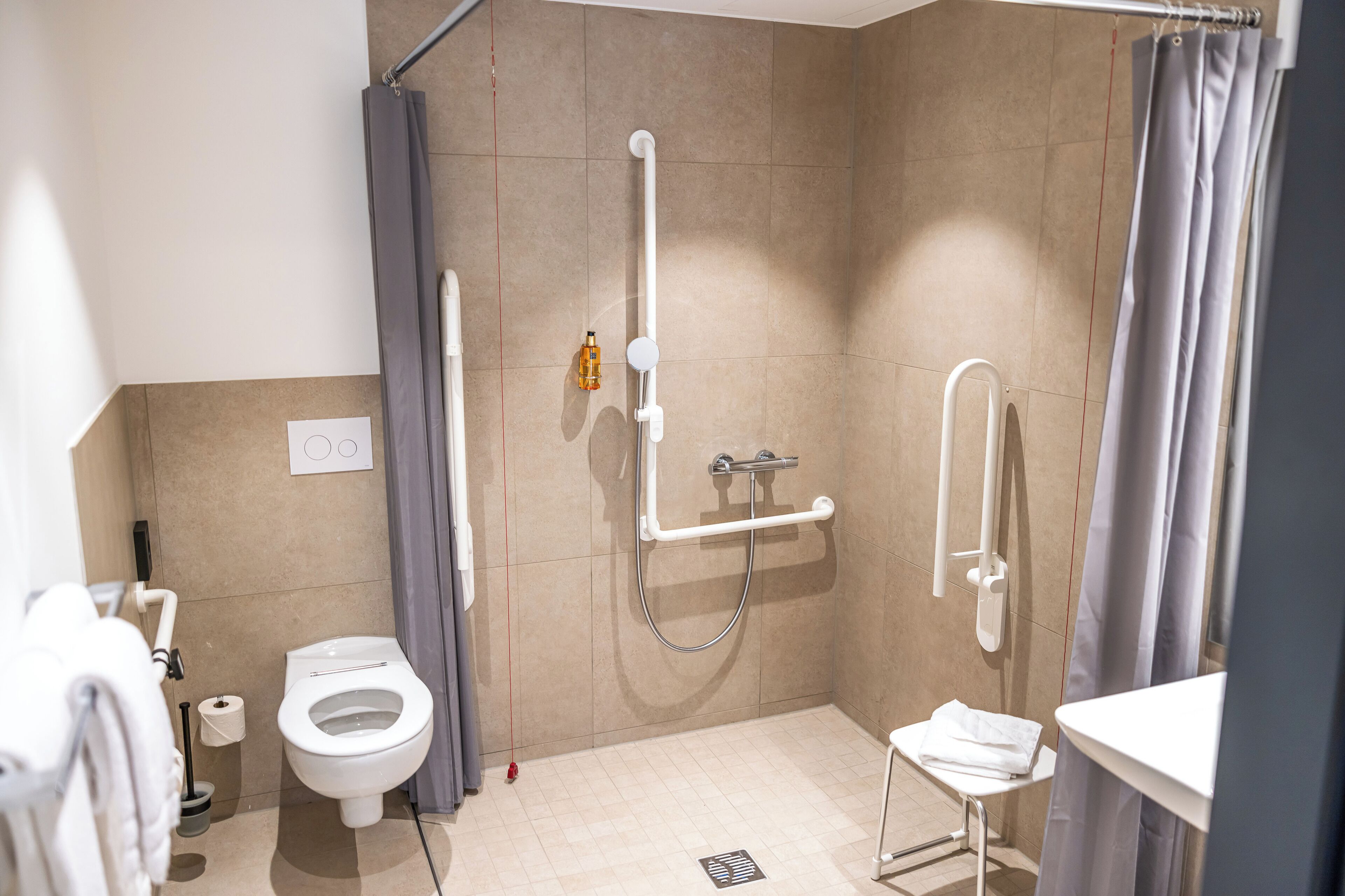 standard double room | bathroom | shower, hair dryer, towels, soap