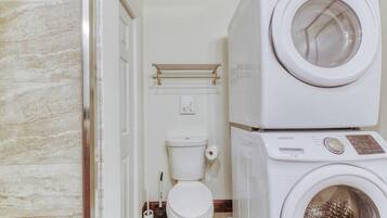 Bathtub, hair dryer, towels