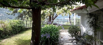 Delightful wooden cottage with dehor and garden surrounded by Ligurian greenery.