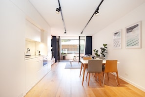 Enjoy a comfortable stay in this stylish apartment with a dining area, compact kitchen, and cozy seating space.