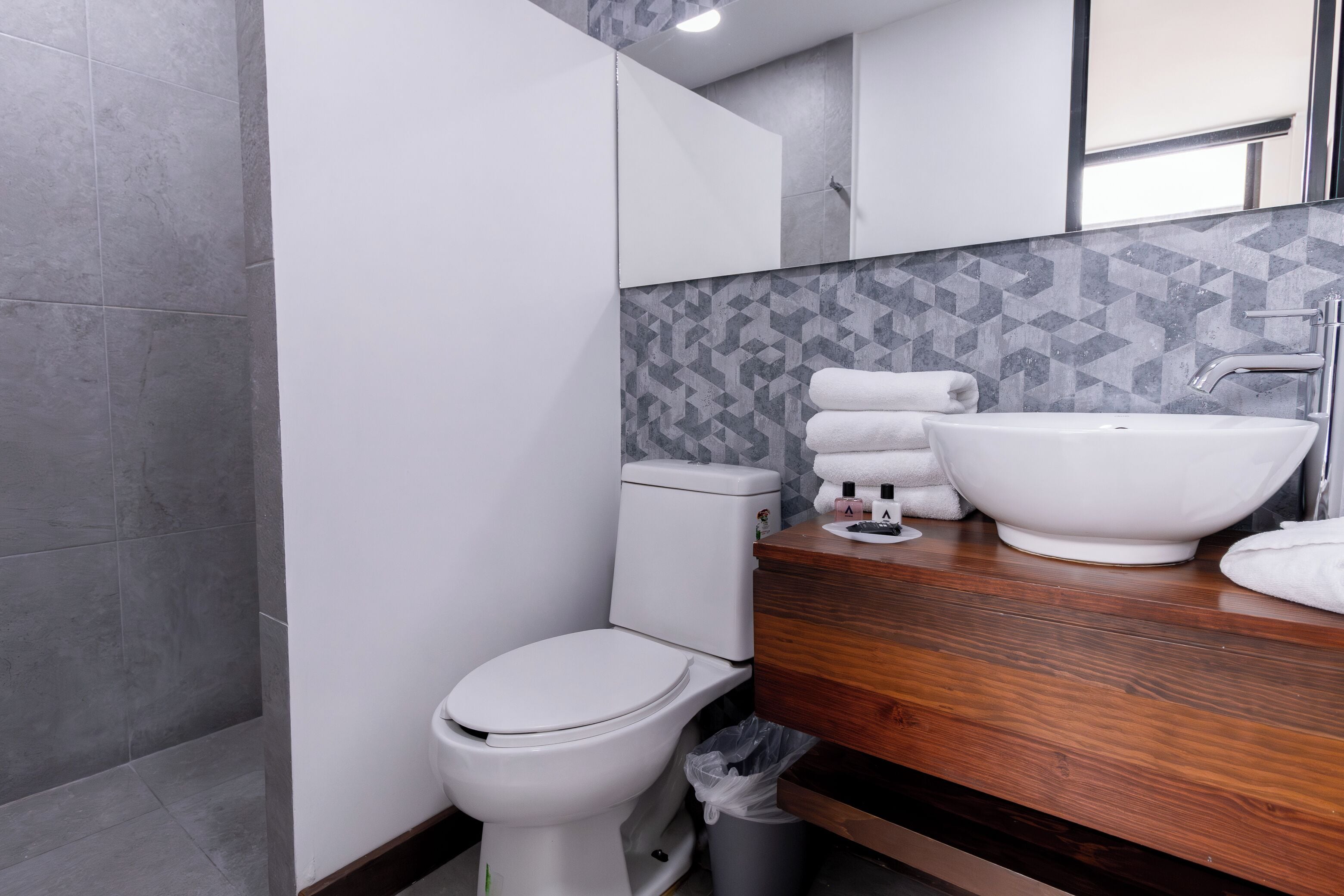 standard suite | bathroom | shower, free toiletries, hair dryer, towels
