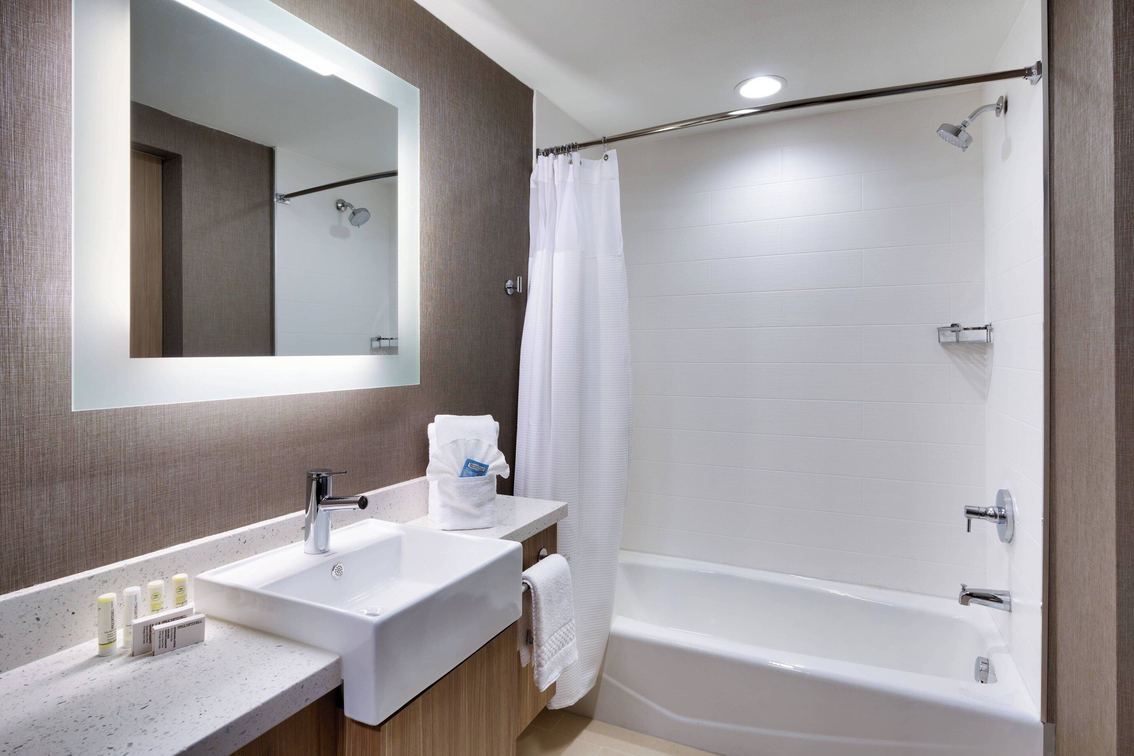 suite, 2 queen beds, non smoking | bathroom | combined shower/bathtub, hair dryer, towels, soap