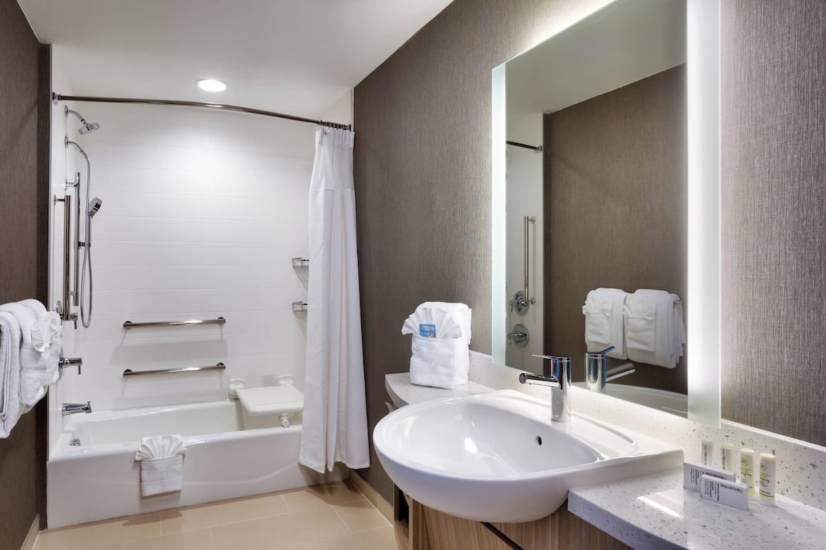 combined shower/bathtub, hair dryer, towels, soap