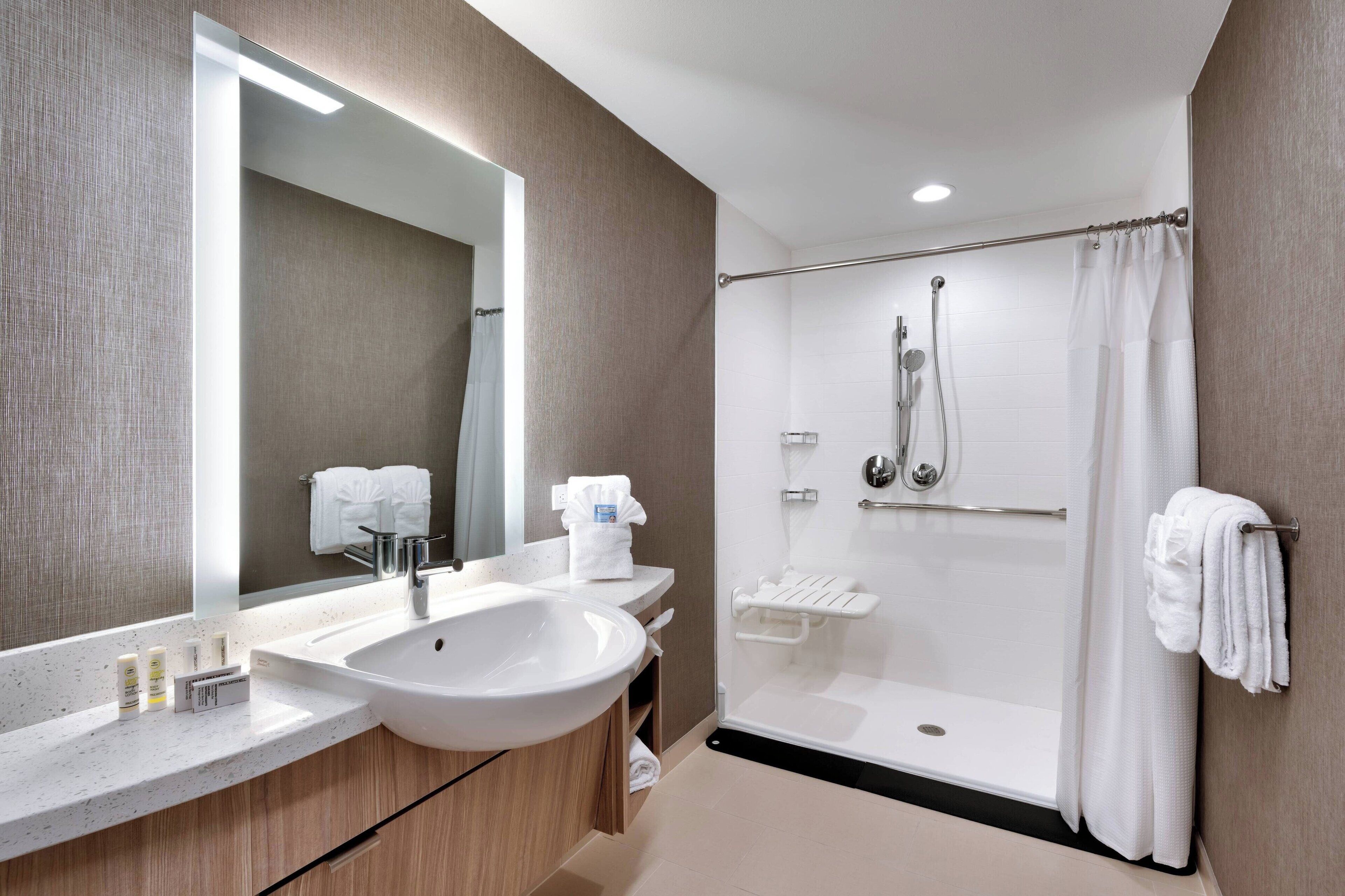 suite, 2 queen beds, non smoking | bathroom | combined shower/bathtub, hair dryer, towels, soap