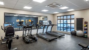 A gym with treadmills, an elliptical, and exercise balls. - Comfort Inn & Suites Harrisonburg (Harrisonburg)