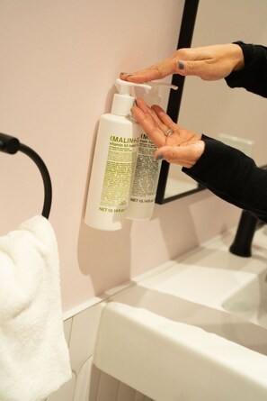 Hair dryer, towels, soap, shampoo