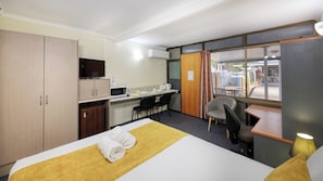 Executive Queen Room | Select Comfort beds, laptop workspace, blackout drapes