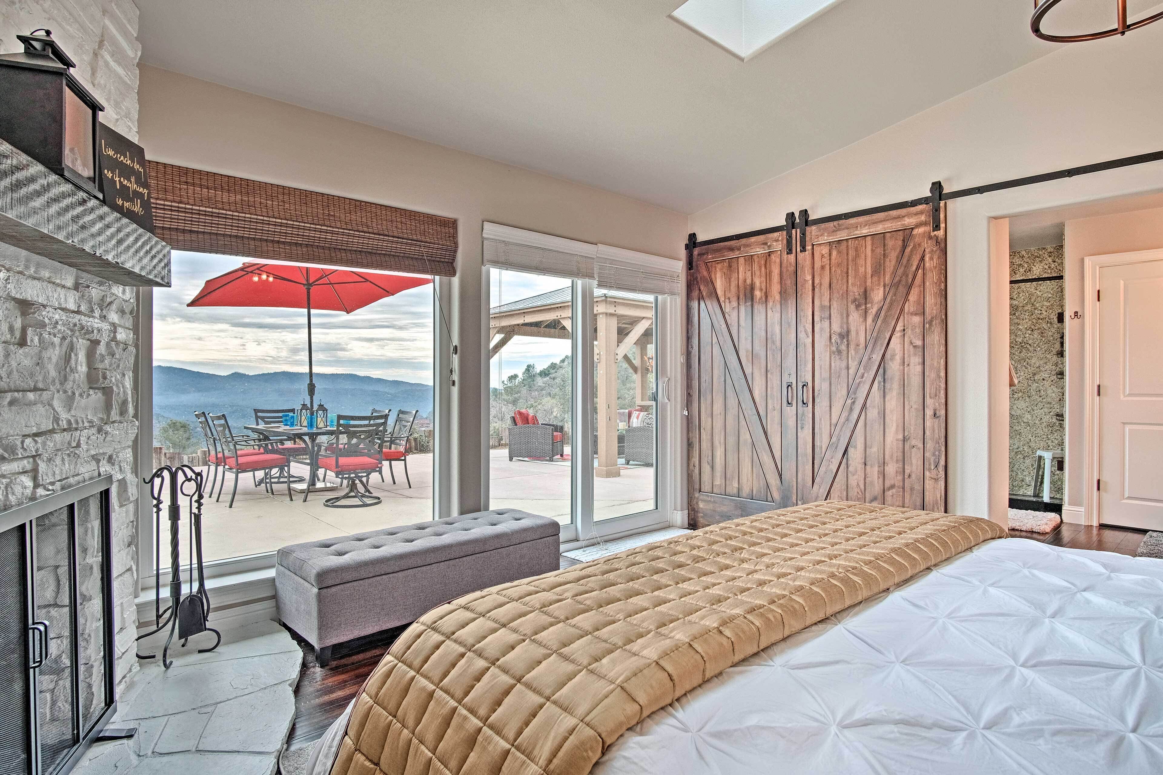 Master bedroom with large barn doors and access to backyard