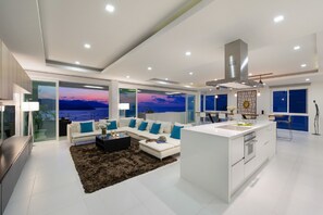 Q3 Penthouse K | Living area | 42-inch LED TV with cable channels, TV, books - Luxury Apartment Unique Residences (Koh Samui)