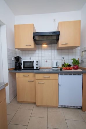 Fridge, oven, highchair, cookware/dishes/utensils