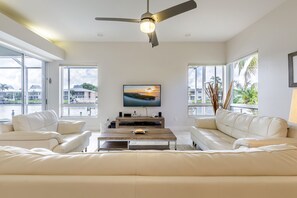 TV, stereo - Yacht Club Area, Canal Sunsets, Fish from dock, Tiki Bar, Pool - Villa Poinciana - Roelens Vacations (Cape Coral)