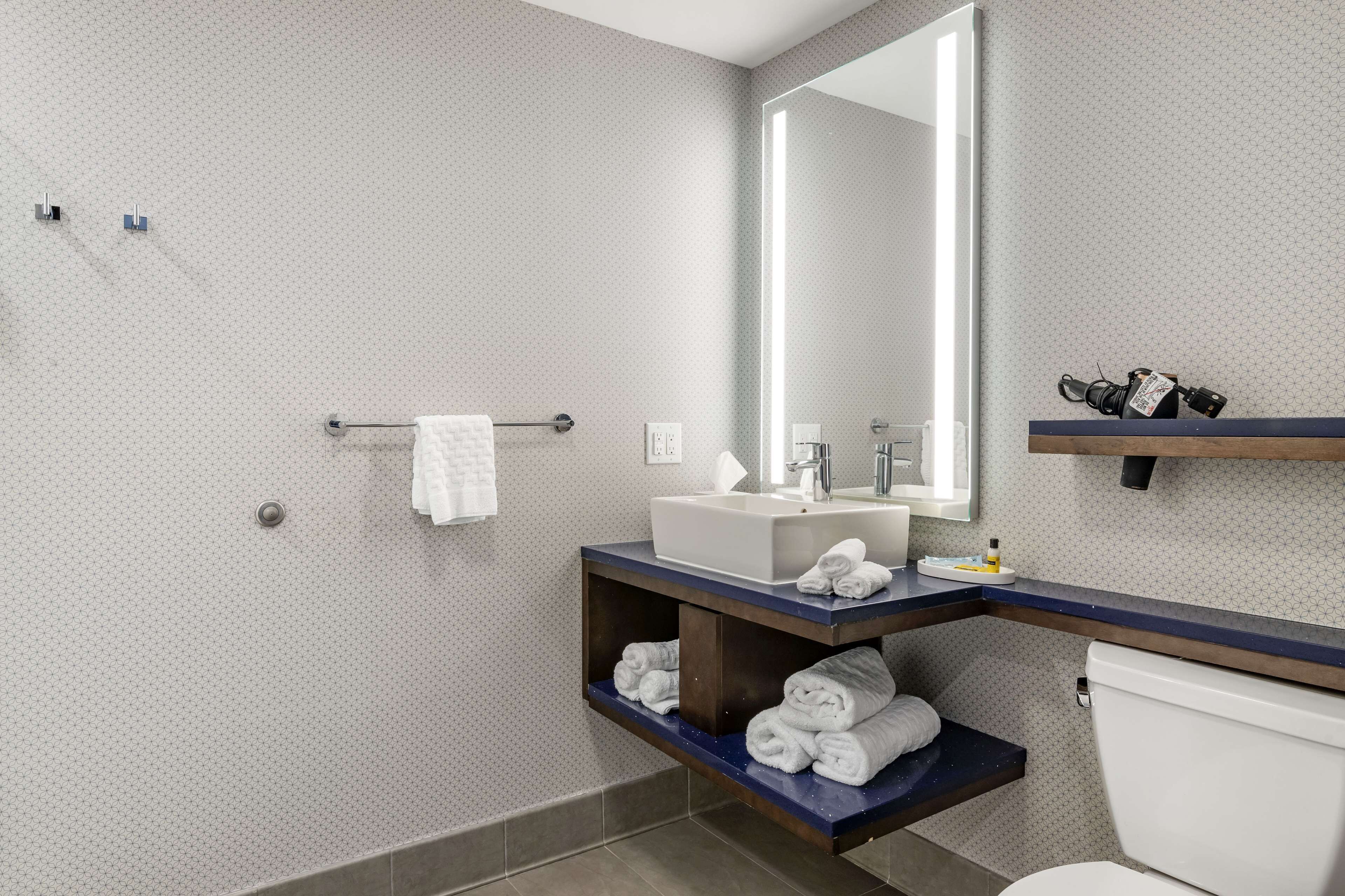 shower, rainfall showerhead, hair dryer, towels