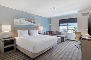 Desk, laptop workspace, blackout drapes, iron/ironing board