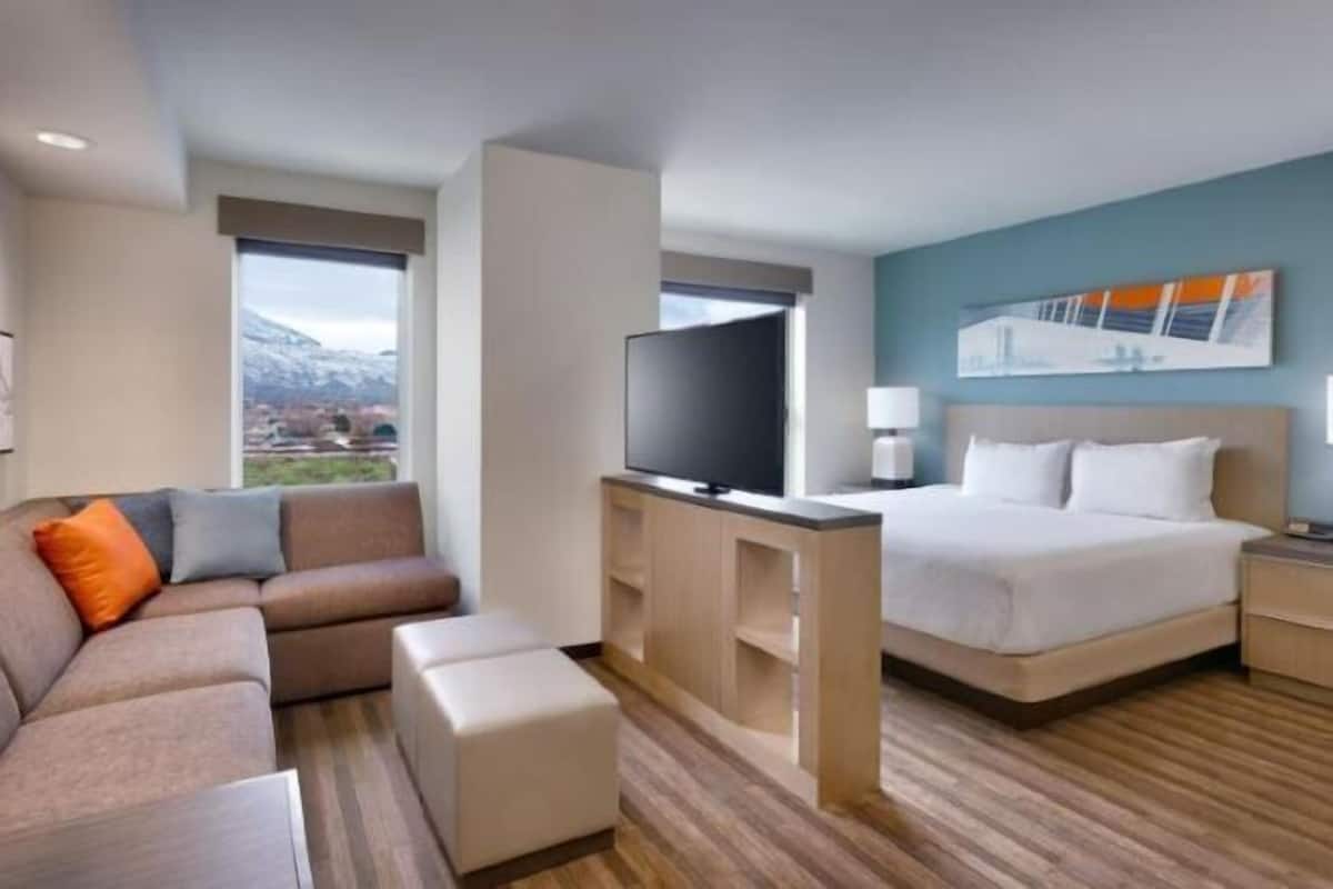 Desk, laptop workspace, blackout drapes, iron/ironing board