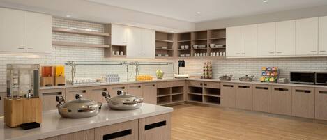 Una cocina moderna con armarios de madera, una isla central y un microondas.
