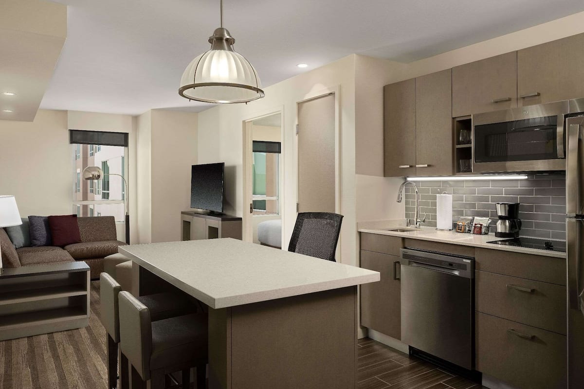 desk, laptop workspace, blackout curtains, iron/ironing board