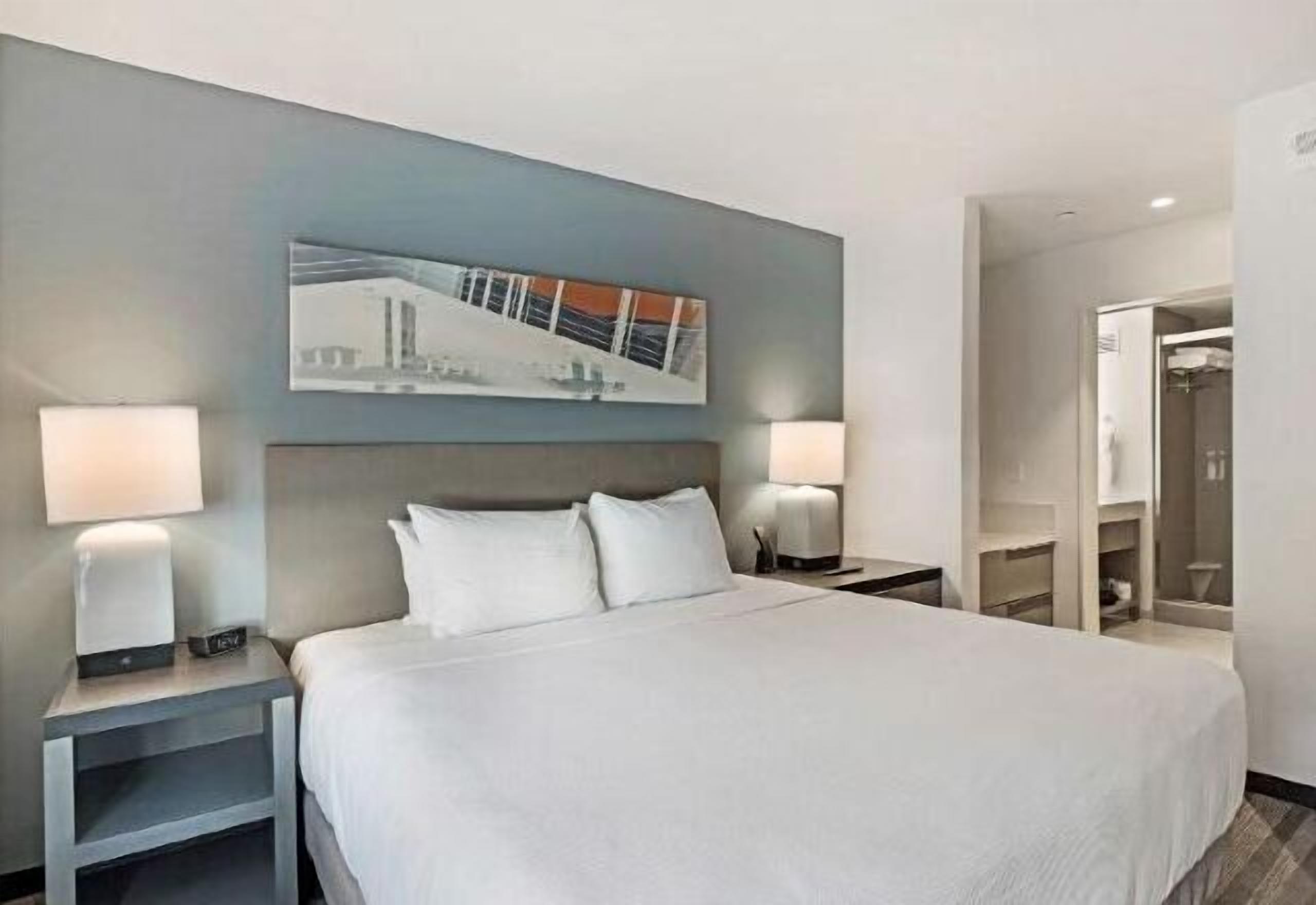 Desk, laptop workspace, blackout drapes, iron/ironing board