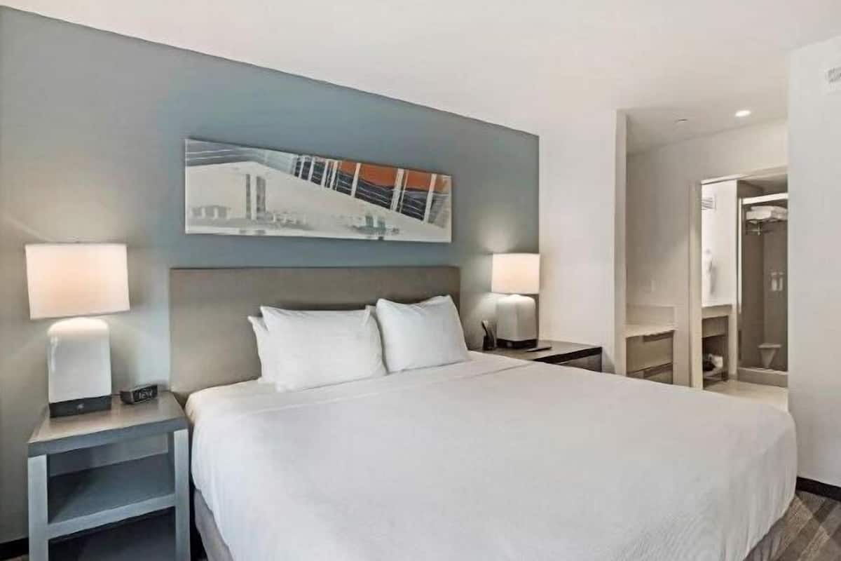 Desk, laptop workspace, blackout drapes, iron/ironing board