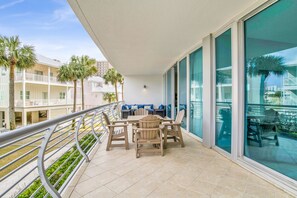 Enjoy al fresco dining and poolside views from this spacious balcony.
