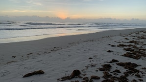 A beach with waves, a clear sky, and distant clouds. - Happy Hours I New Smyrna Poolside at the Beach 2bd/2ba +loft (New Smyrna Beach)
