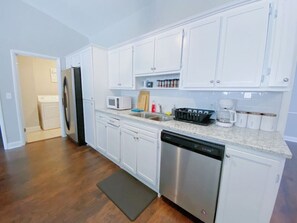 Fridge, coffee/tea maker, cookware/dishes/utensils