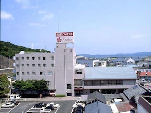 Experience the Azalea, a modern hotel situated in a developed area with scenic views of a nearby body of water.
