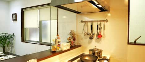 Fridge, microwave, stovetop, cookware/dishes/utensils