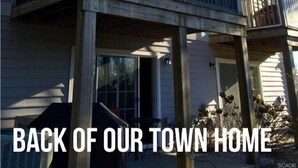 A two-story town home with a balcony and a covered porch area. - Spacious 4 Bed, 4,5 bath. Pet friendly. Come enjoy Rehoboth! (Rehoboth Beach)