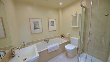 Bathtub, hair dryer, towels, soap