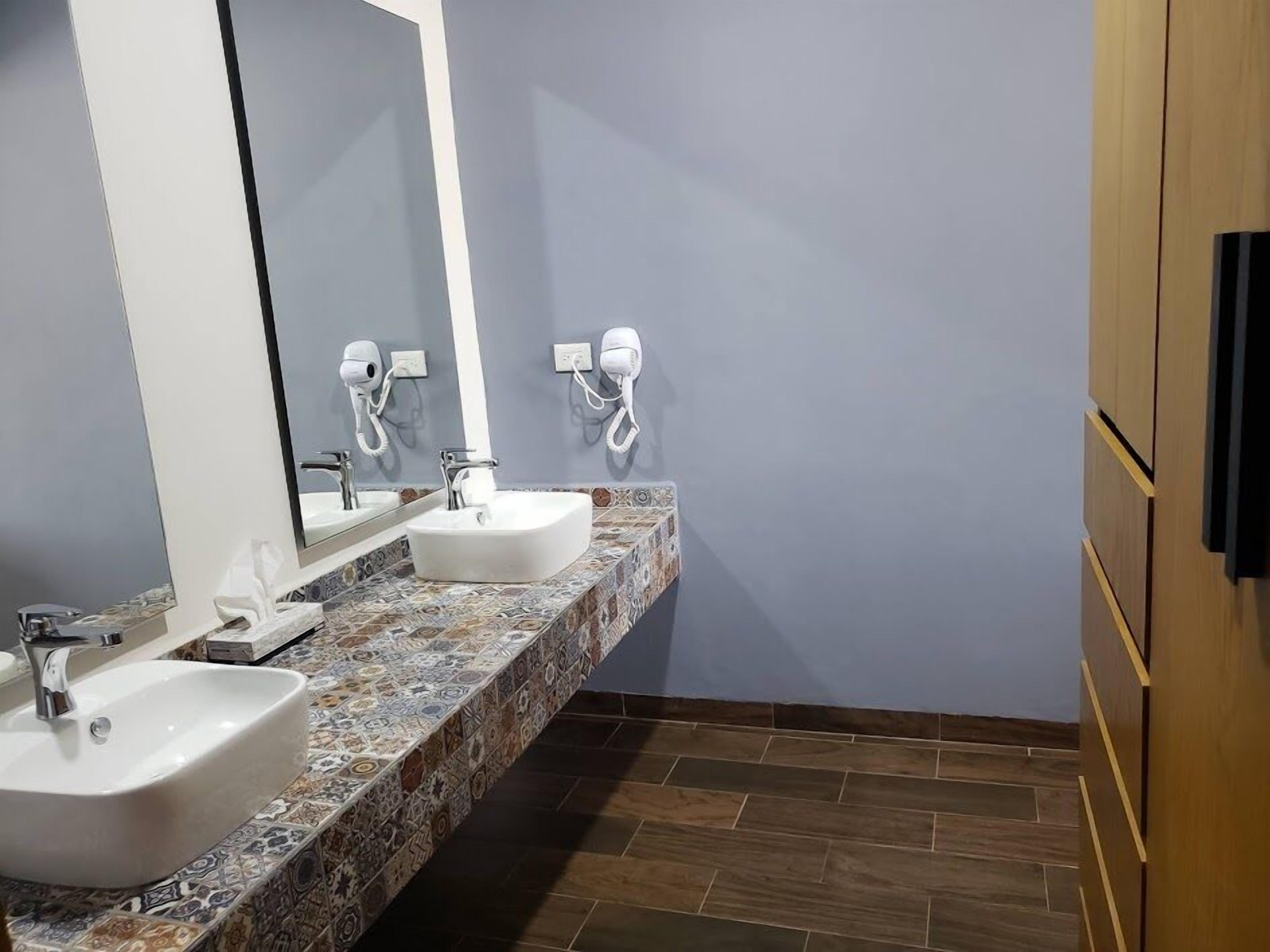 studio suite | desk, laptop workspace, blackout curtains, soundproofing