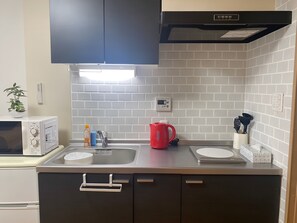 Standard Apartment, 1 Bedroom, Non Smoking | Private kitchen | Fridge, microwave, stovetop, electric kettle - sincereresidence (Osaka)