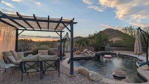 A patio area with a pool, outdoor furniture, and a pergola. - ADOBE MANOR // Main + Guest Home // Sleeps 20 (Mesa)