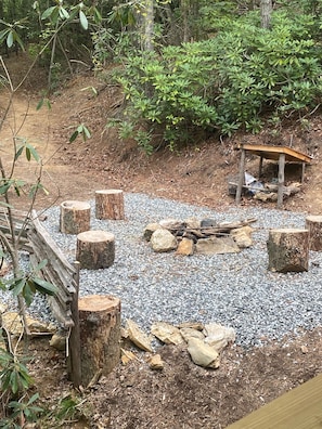 Sit and unwind in a serene wooded setting, surrounded by lush foliage.