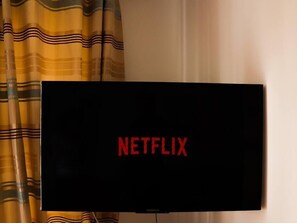 A television with the Netflix logo on its screen.