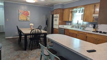 Fridge, stovetop, coffee/tea maker, cookware/dishes/utensils