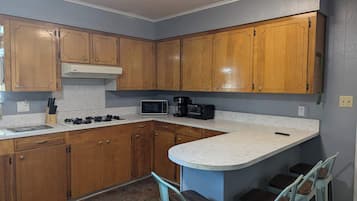 Fridge, stovetop, coffee/tea maker, cookware/dishes/utensils