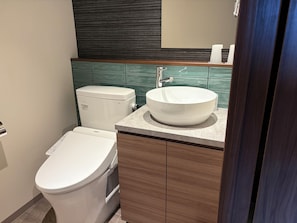 A modern bathroom with a toilet, bidet, and sink. - someone, kyoto (Kyoto)